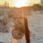 Icielani in her supplied Beautiful campaign portrait on a beach at sunset.