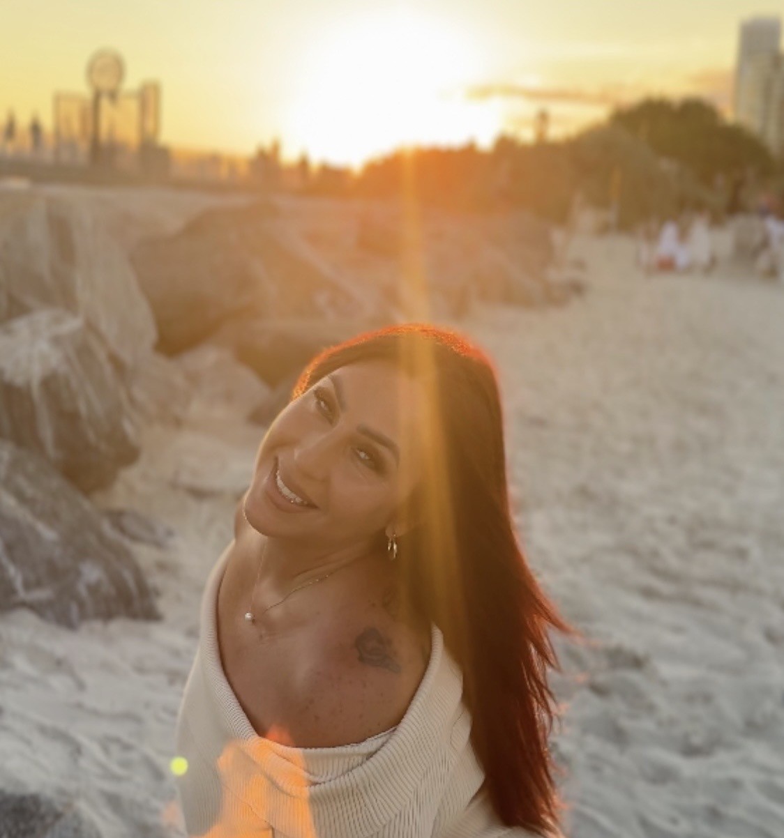 Icielani in her supplied Beautiful campaign portrait on a beach at sunset.
