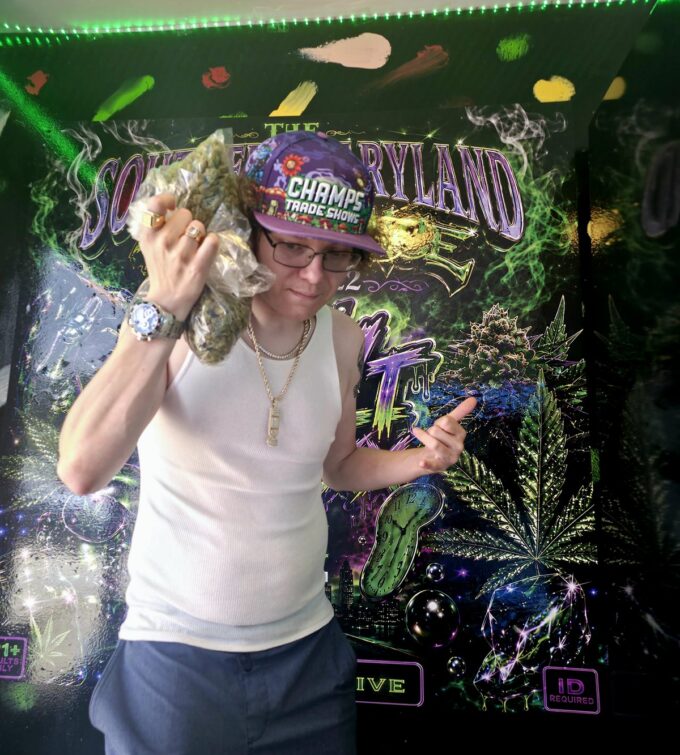 Stevieontay Burnz in front of a Southern Maryland Experience display